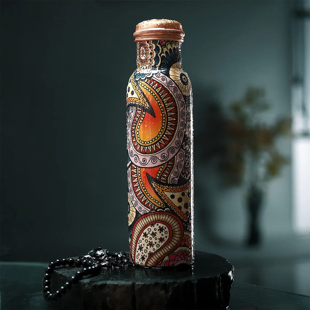 Multi Color Printed Copper Bottle with Shungite Infuser and Shungite Bracelet  Bottle Size: Height- 10.6 inches, Diameter- 2.75 inches, Bracelet - 6mm Bottle Capacity: Approx. 32 Oz.