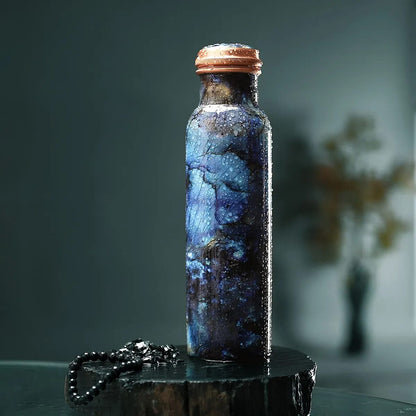 Multi Color Printed Copper Bottle with Shungite Infuser and Shungite Bracelet  Bottle Size: Height- 10.6 inches, Diameter- 2.75 inches, Bracelet - 6mm Bottle Capacity: Approx. 32 Oz.