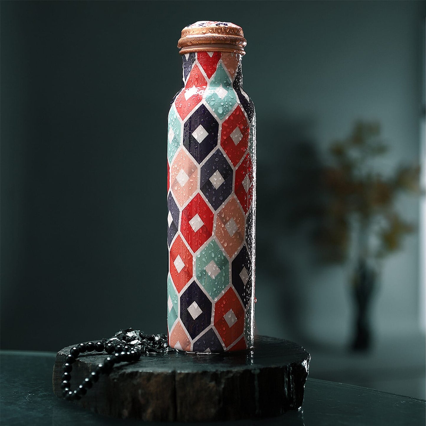 Multi Color Printed Copper Bottle with Shungite Infuser and Shungite Bracelet  Bottle Size: Height- 10.6 inches, Diameter- 2.75 inches, Bracelet - 6mm Bottle Capacity: Approx. 32 Oz.