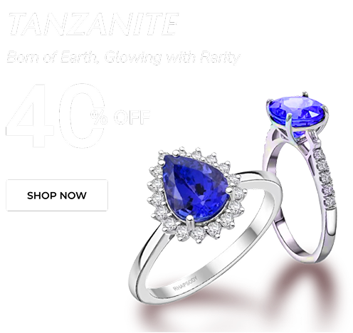 Two silver rings with blue gemstones on a white background